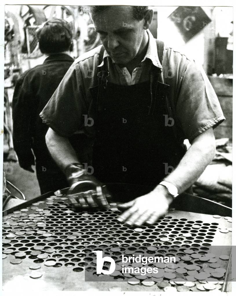 Blank sorting to remove incomplete or defective pieces, Royal Mint, Tower Hill, c.1970 (b/w photo)