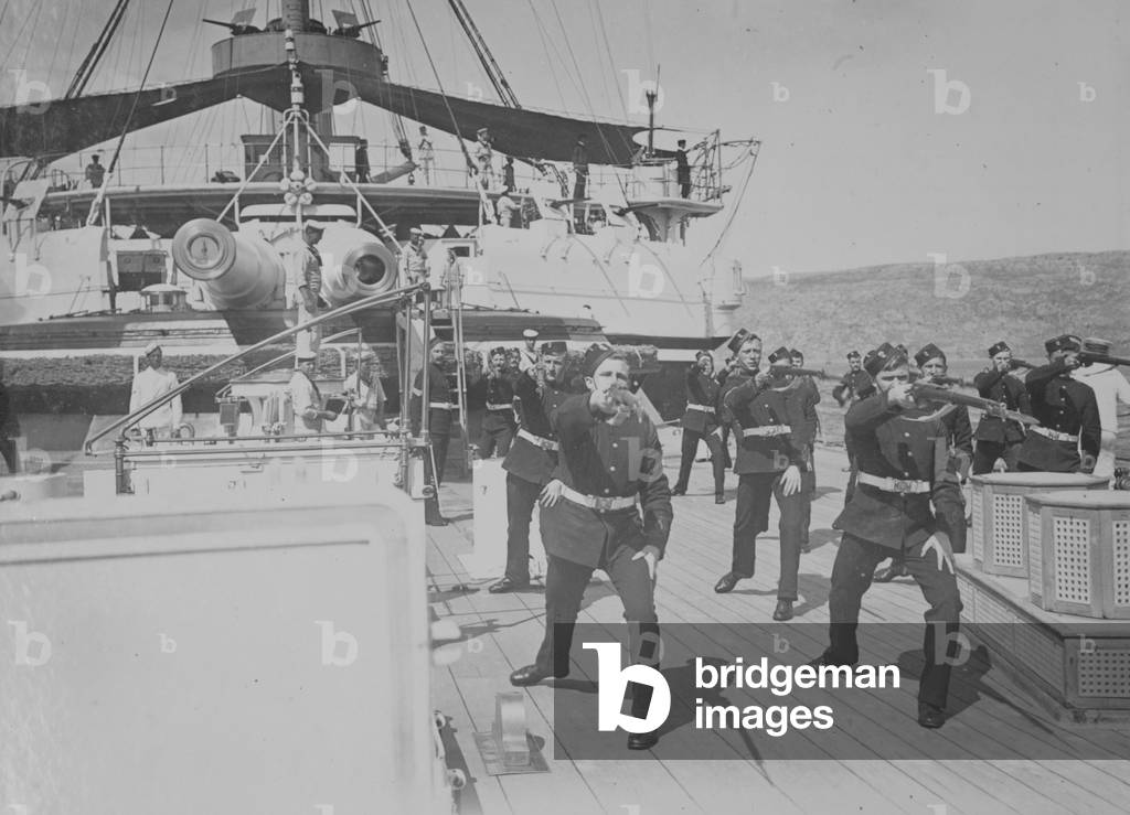 Royal Marine Artillery at Bayonet Exercise under the direction of Captain Homer while serving aboard the battleship HMS Camperdown, 1896 (b/w photo)