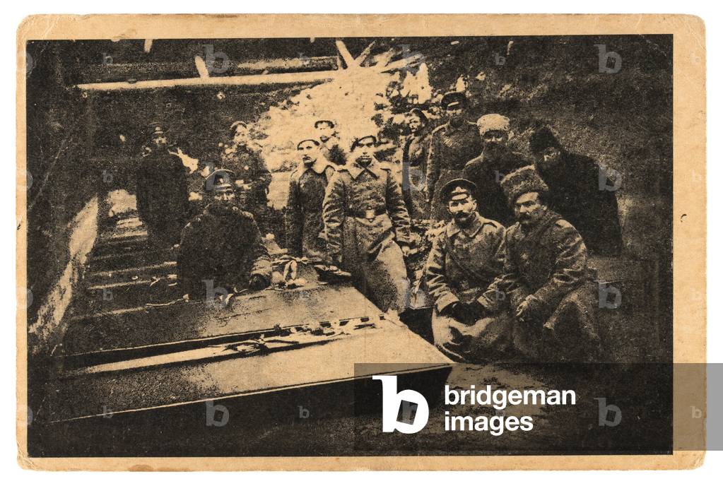 Russian postcard printed after the overthrow of Tsar Nicholas II depicting revolutionary troops at communal grave for the victims of the Revolution in Petrograd