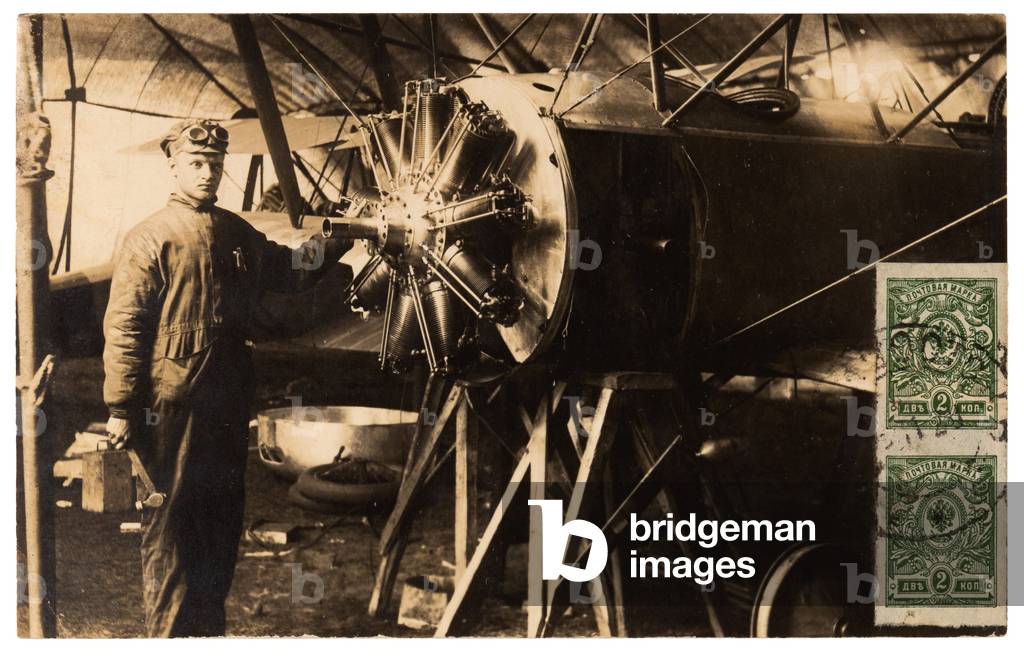 Photographic postcard depicting aviator with his aeroplane during  the Russian Civil War, 1920 (postcard)