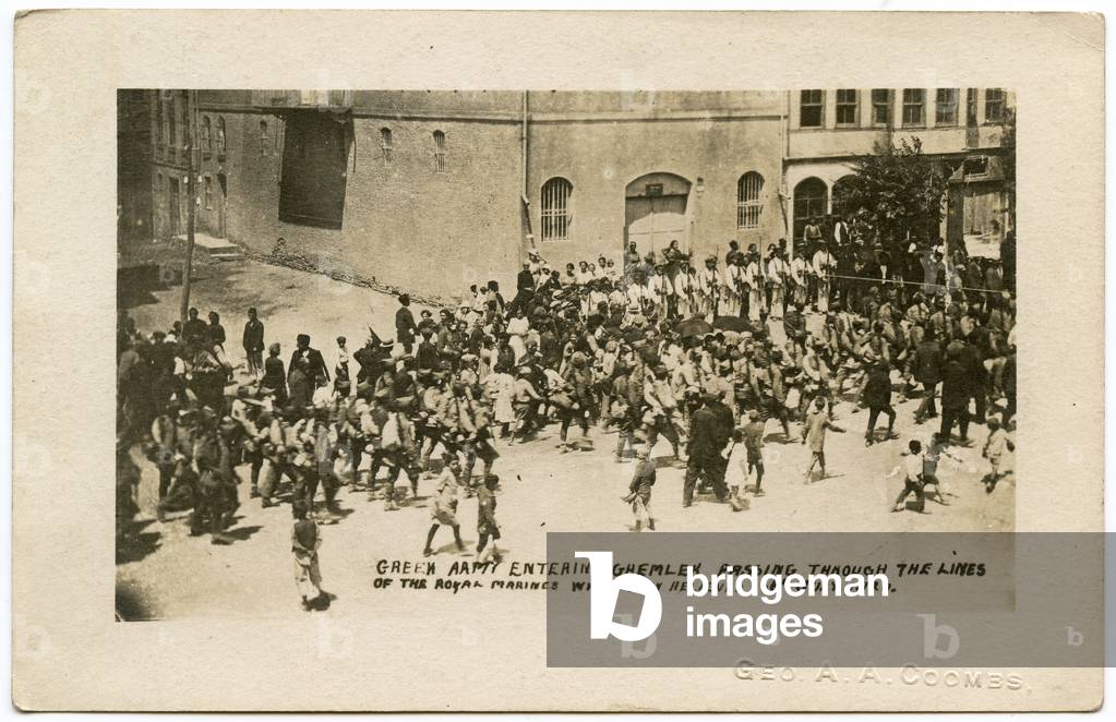 Postcard Depicting Greek Relief Force in Gemlik passing through lines of British Army Royal Marines, 1920