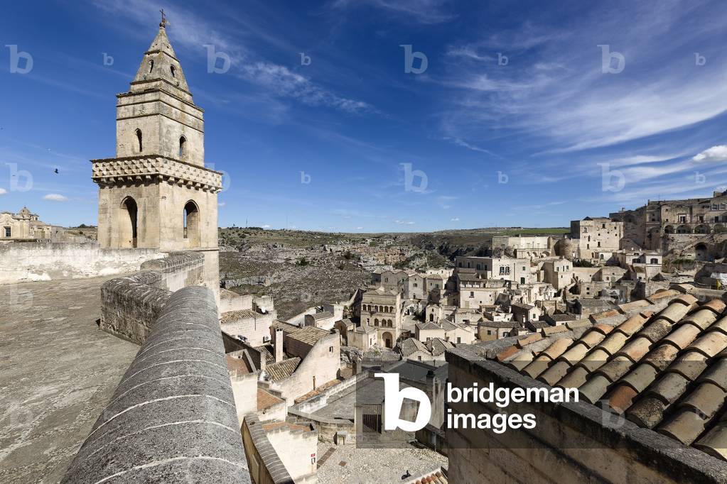 Bell tower of the Church of San Pietro Barisano and view of the stones, Matera, Italy (photo)
