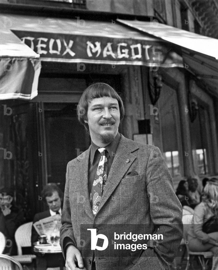John Brunner (1934-1995) english writer, in Paris outside the cafe 'Les Deux Magots'