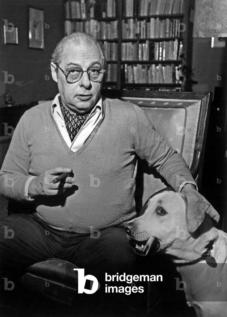 Roger Stephane (1919-1994) french writer and journalist, at home with his dog, 80's