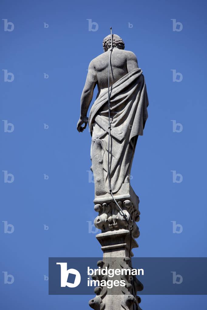 Statue on a pinnacle, Milan Cathedral, Italy, 2010 (photo)