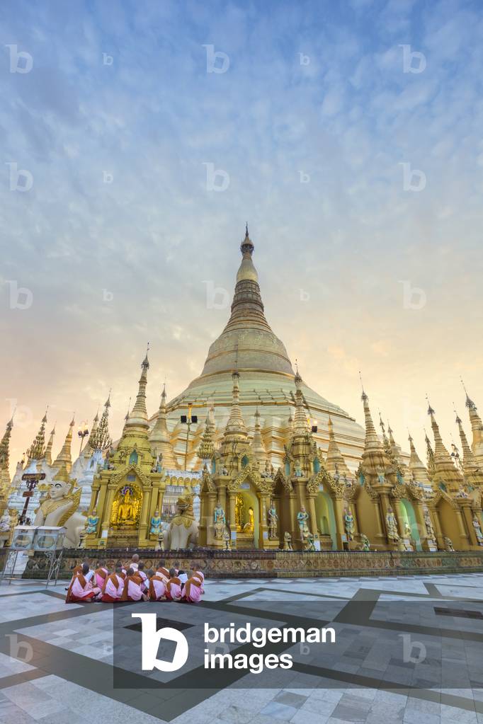 Nuns in front of the Shwedagon pagoda shortly after sunrise, Yangon, Myanmar (photo)