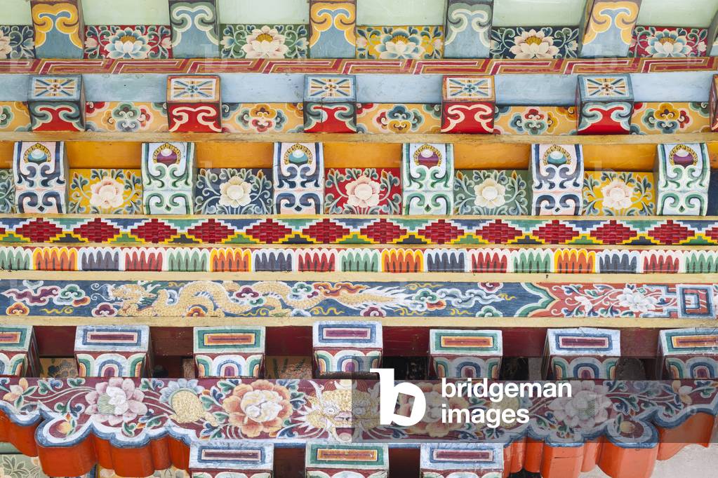 Colourful architectural detail of the windows of the Shechen monastery near Boudhanath, Kathmandu, Nepal