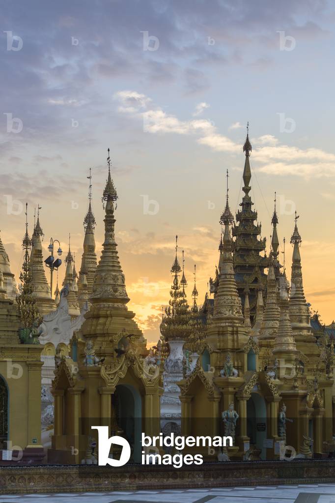 The spires of Shwedagon pagoda shortly after sunrise, Yangon, Myanmar (photo)