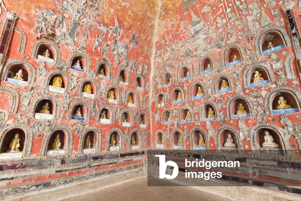 Wall with small Buddhas and leaded glass figures, Shwe Yaunghwe Kyaung Monastery, Nyaungshwe, Inle Lake, Myanmar (photo)