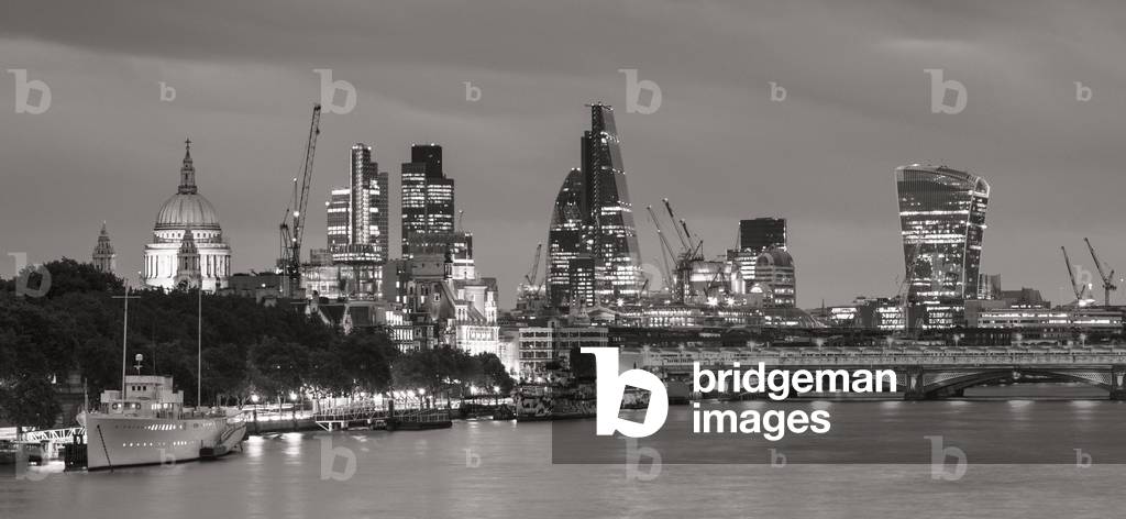 London skyline and river Thames at dusk, London, England