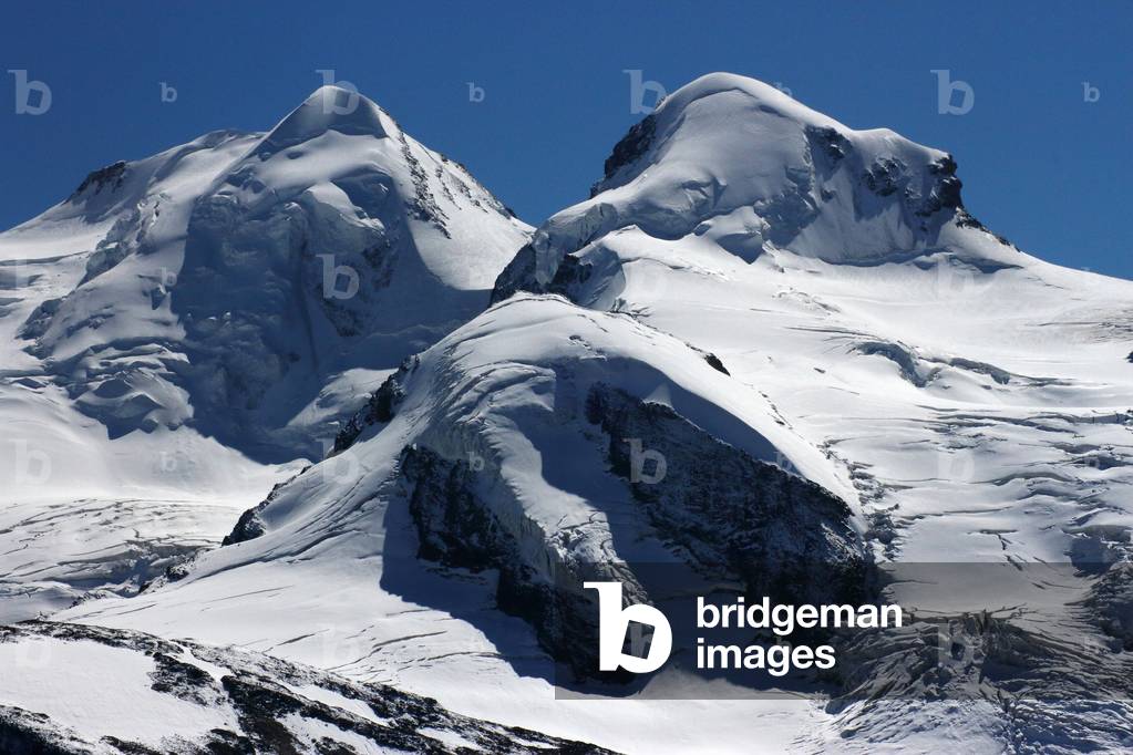 Castor (4223 meters) on the left and Pollux (4092 meters) on the right, in the Valais Alps on the border between the canton of Valais and the region of Valais d'Aosta, Switzerland, These two summits are named in reference to the Dioscurs of Greek mythology, 2019 (photo)