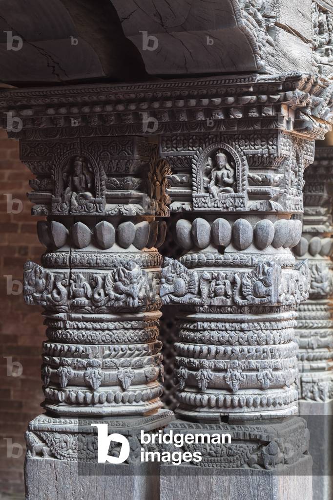 Decorated wooden columns inside the Mul Chowk courtyard, Patan Durbar Square. Patan, Nepal