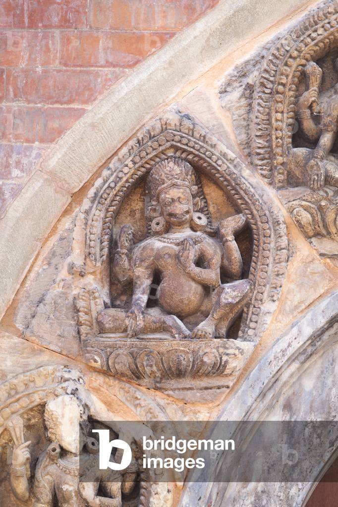 Detail of hindu carvings on the entrance door to the royal palace, Durbar Square, Patan, Nepal