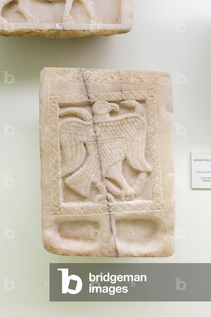 Relief slab of snake and eagle
