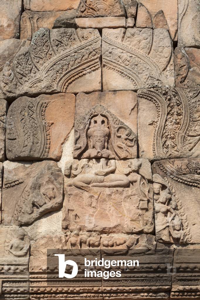 Detail of the pediment depicting Shiva in his aspect of Yoga Dakshinamurti (teacher of yoga) at the main doorway of Prasat Hin Phanom Rung temple, Phanom Rung historical park, Buriram province, Thailand (photo)