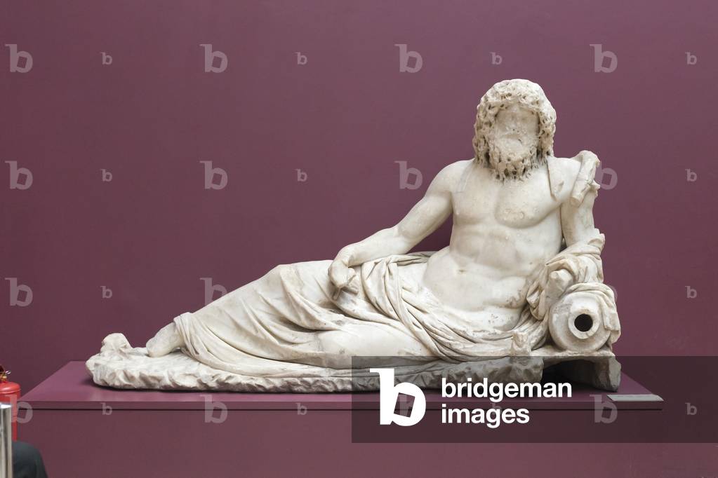 Museum display showing the Statue of Oceanus, translated as the God of Rivers, made from marble in Ephesus (Efes),  2nd Century AD (marble)