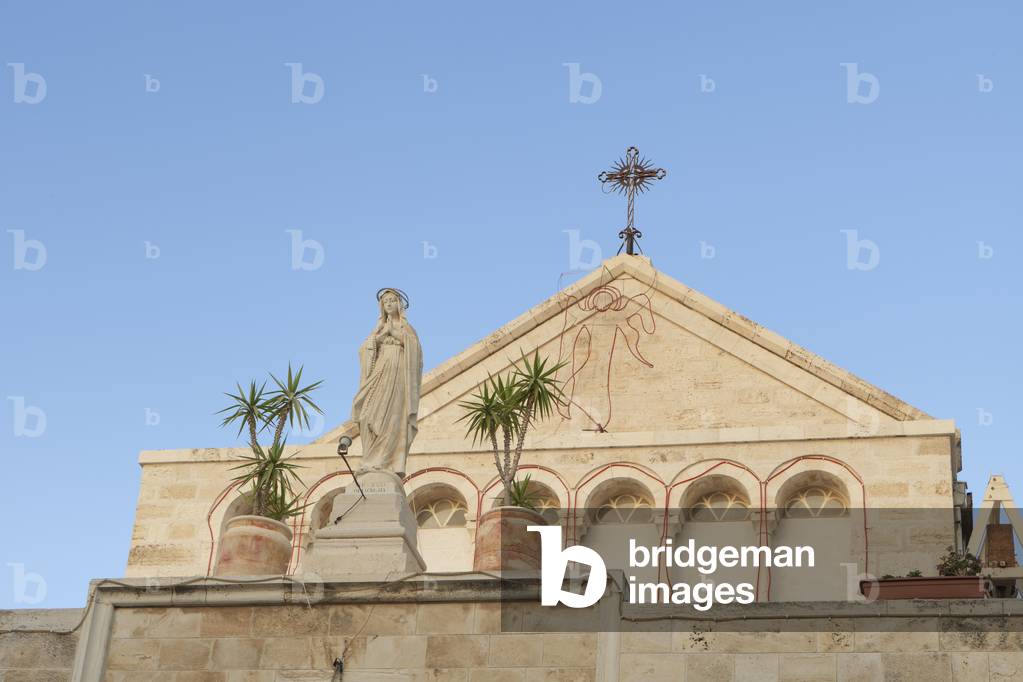 Statue of St Catherine at the entrance to the Church of St Catherine, Bethlehem, Palestine (photo)