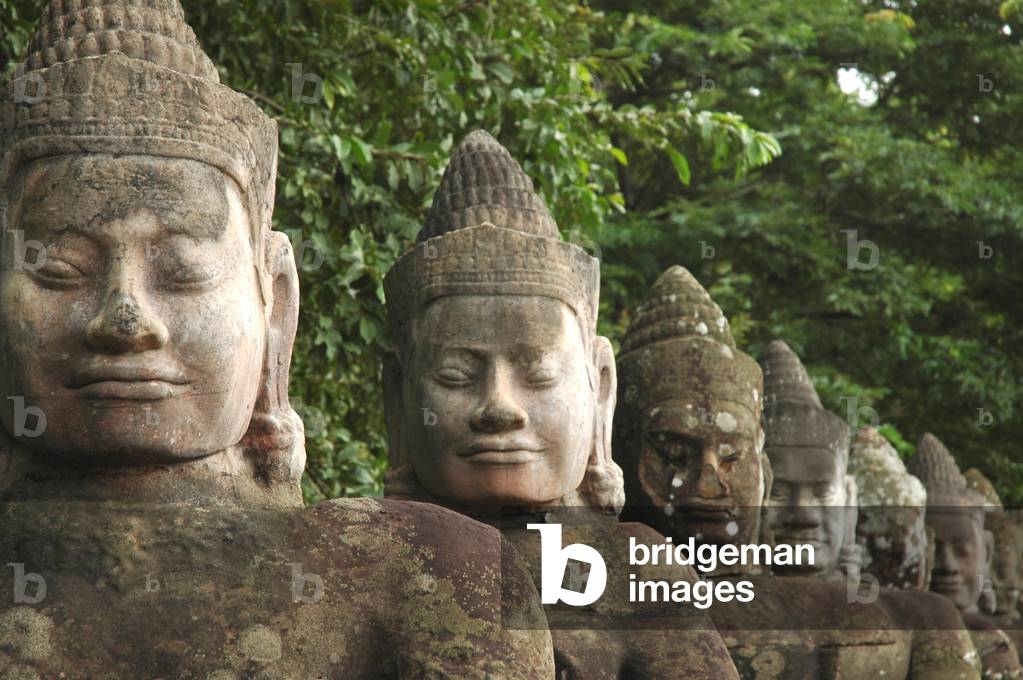 Line of demons at entrance to gate, South Gate, Buddhist-Hindu, Angkor Thom, Siem Reap, Cambodia