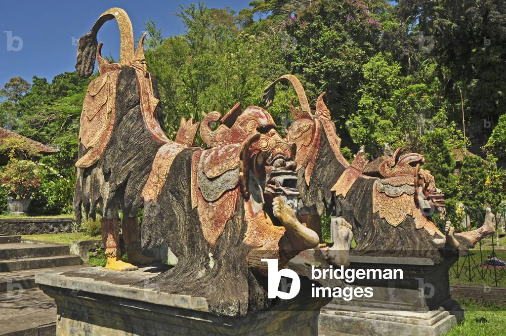 Bali, Karangasem, ancient Water Palace, Taman Tirta Gangga, 1948, built by the last King of Karangasem. Indonesia Large pool with stepping stones and statues of dancers.