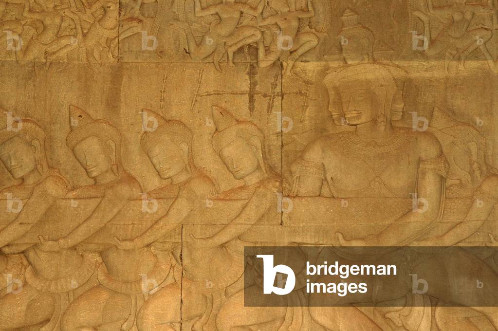 Churning of the Ocean of Milk carving, gods with crested helmets, Budhhist-Hindu Temple, Angkor Wat, Siem Reap, Cambodia