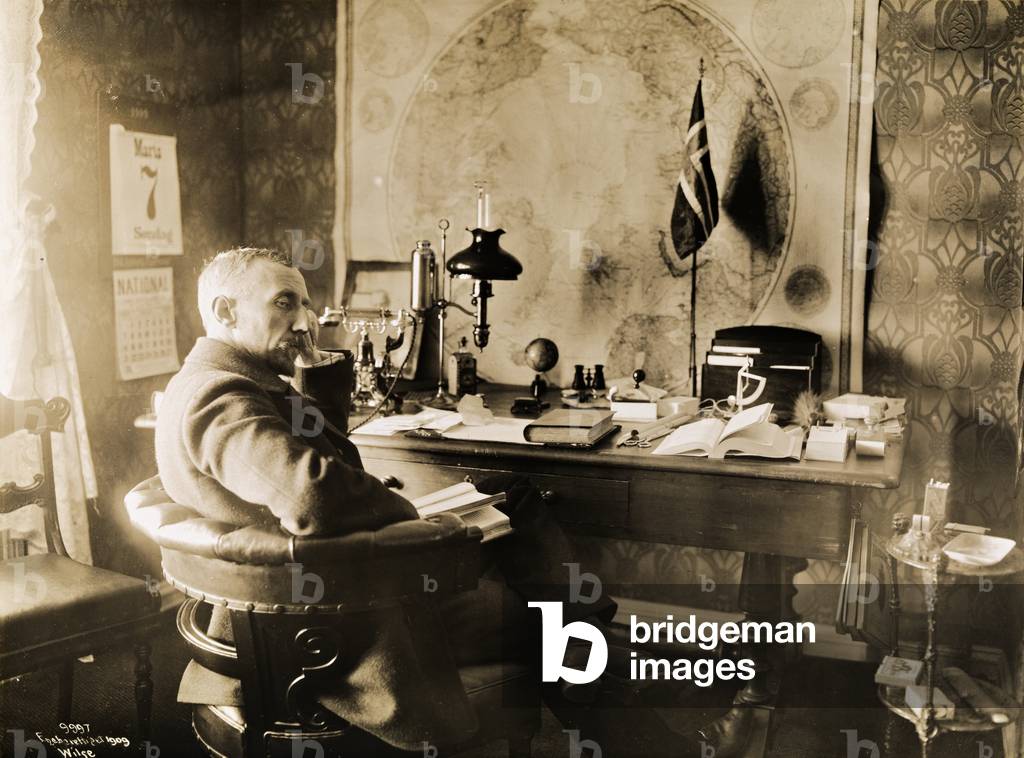 Roald Amundsen in his study at Oranienburg, 1909 (sepia photo)