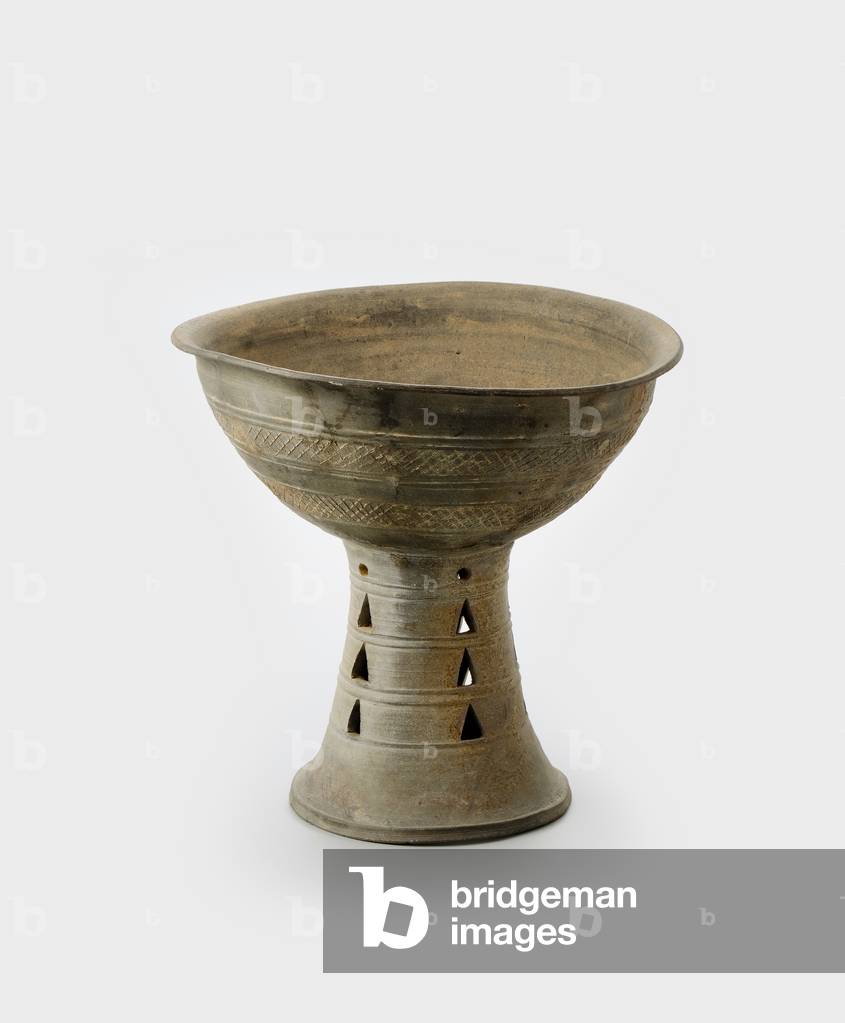 Large vessel stand, 5th century (Stoneware with incised decoration and
openwork)