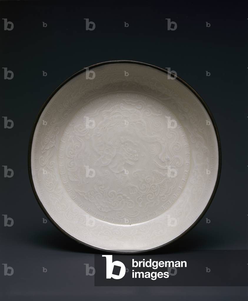Saucer, 12th century (Porcelain with transparent glaze and molded
decoration)