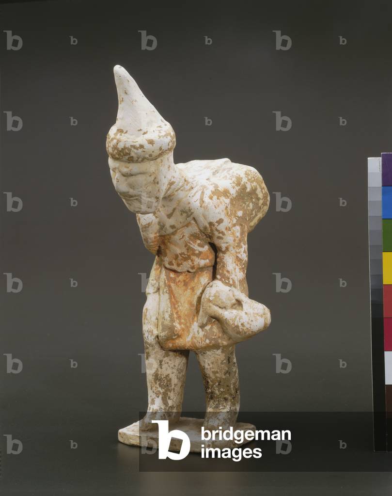 Semitic peddler (earthenware with white slip and polychrome paint)