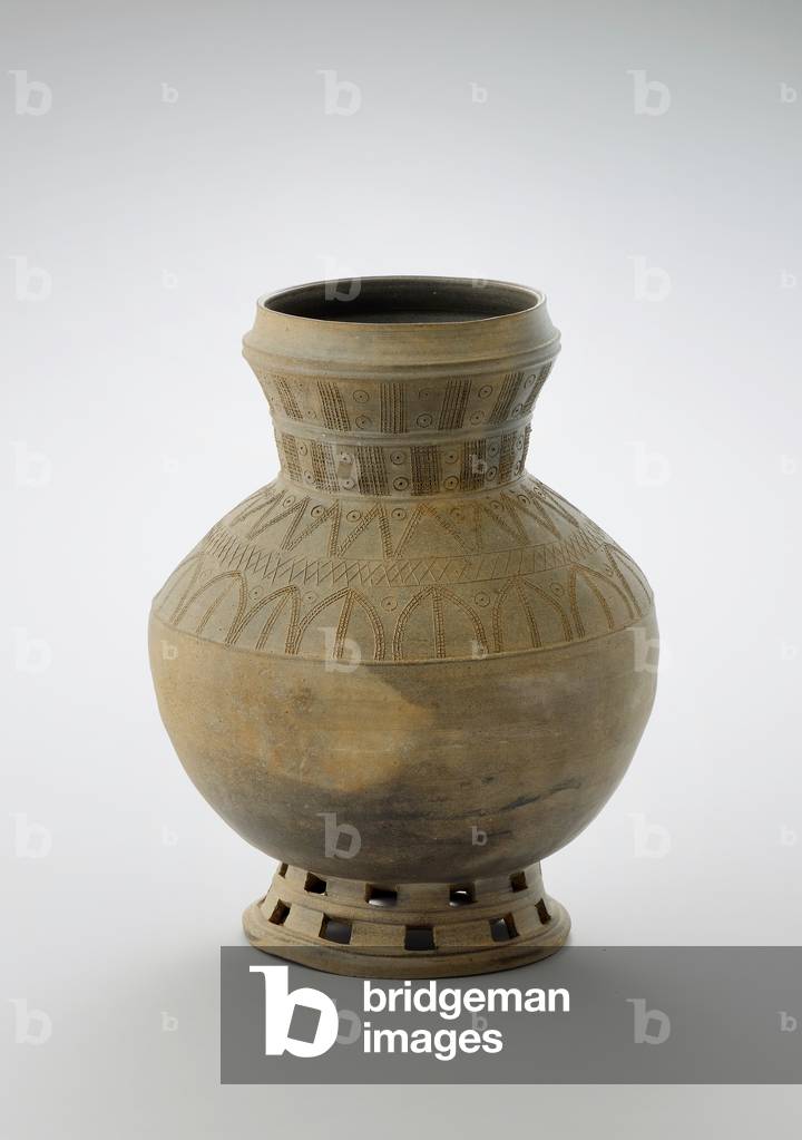 Pedestal jar, late 5th-early 6th century (Stoneware with stamped and incised
decoration and openwork)