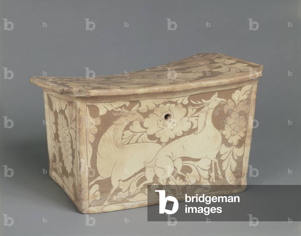 Cizhou ware-type, late 11th-12th century (Stoneware with underglaze, carved decoration in white slip)