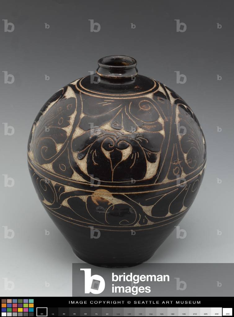 Jar, 13th century (Stoneware with underglaze, carved
decoration in brown-black, white slip)