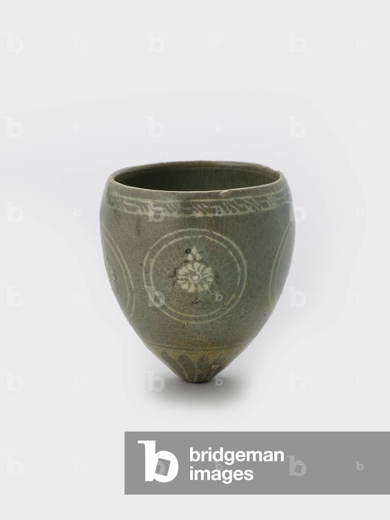 Cup, late 12th century (Stoneware with inlaid slip decoration and
celadon glaze)