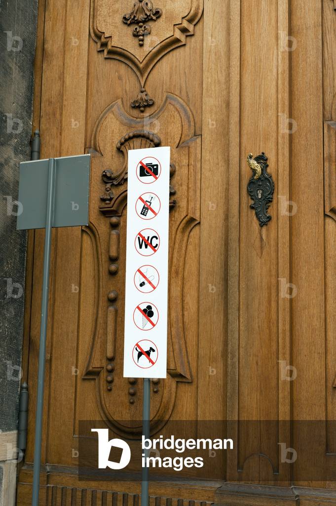 Signs on a church doorway, Dresden, Germany (photo)