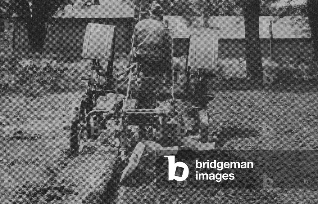 Farmer Using A Tractor Equipped With Tiptoe Wheels.
