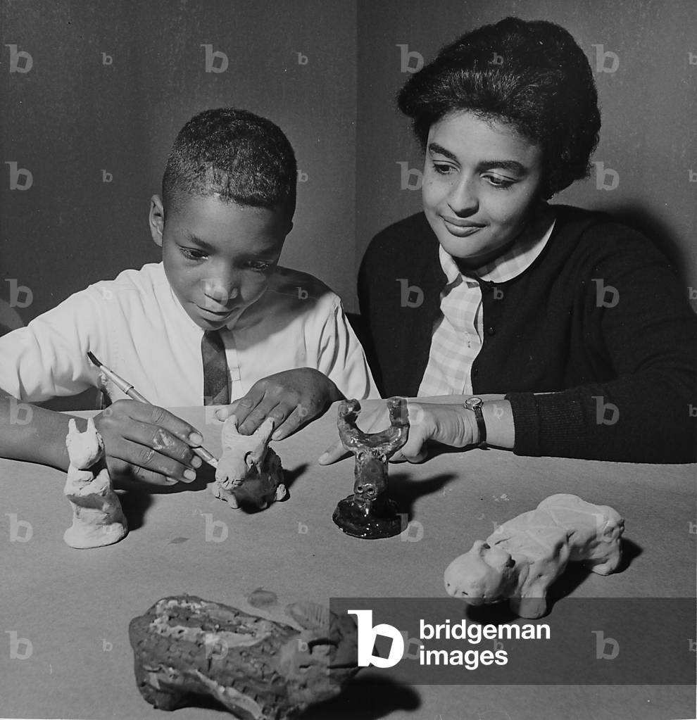 A Young Boy Makes Clay Figures As His Teacher Looks On, Chicago Public Schools Art Fair