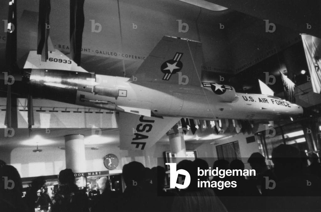 A Group Of People Looking At A United States Air Force Jet Hanging Inside The Museum Of Science And Industry