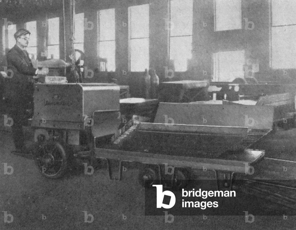 A Man Using An Automatic Transportation Company's Automatic Truck Unit