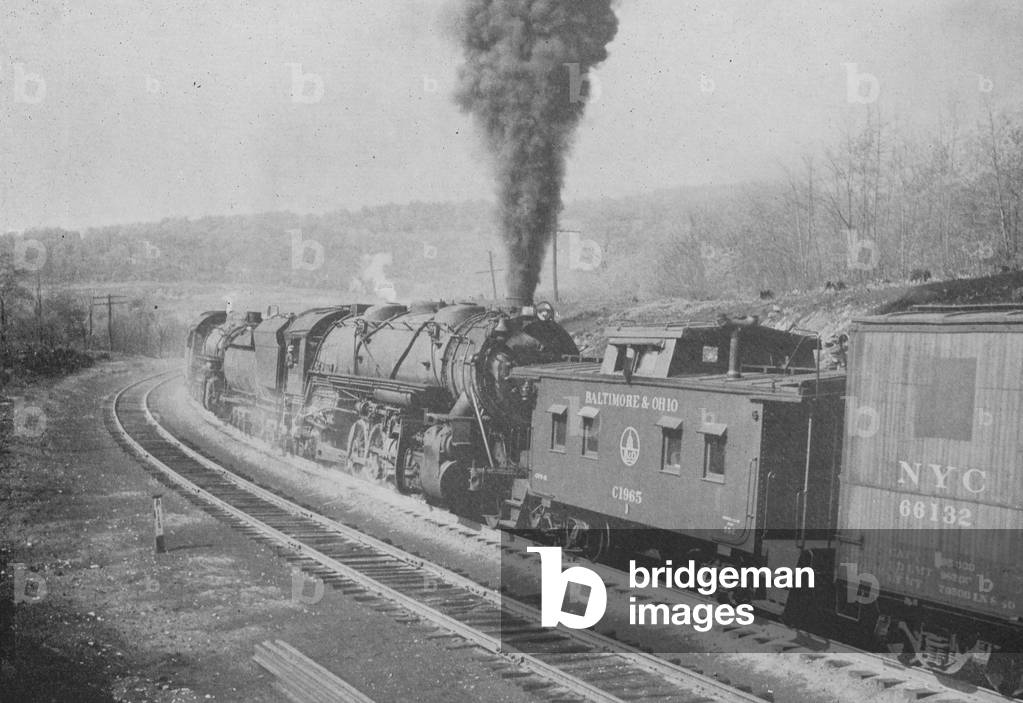 Two Pusher Engines Helping A Train Up A Seventeen Mile Grade