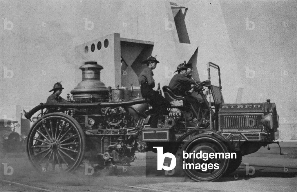 Image Of Men Riding In An Old Motor Driven Steamer