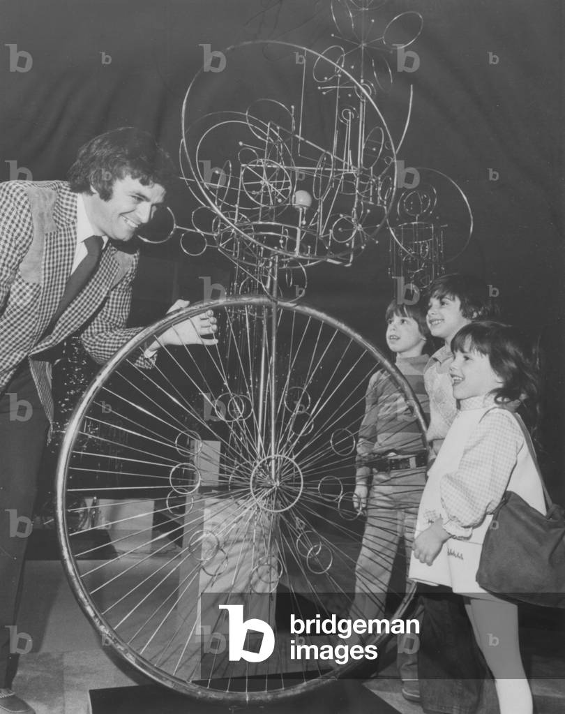 Artist Joseph A Burlini (Left) Shows One Of His Sculptures To A Group Of Children
