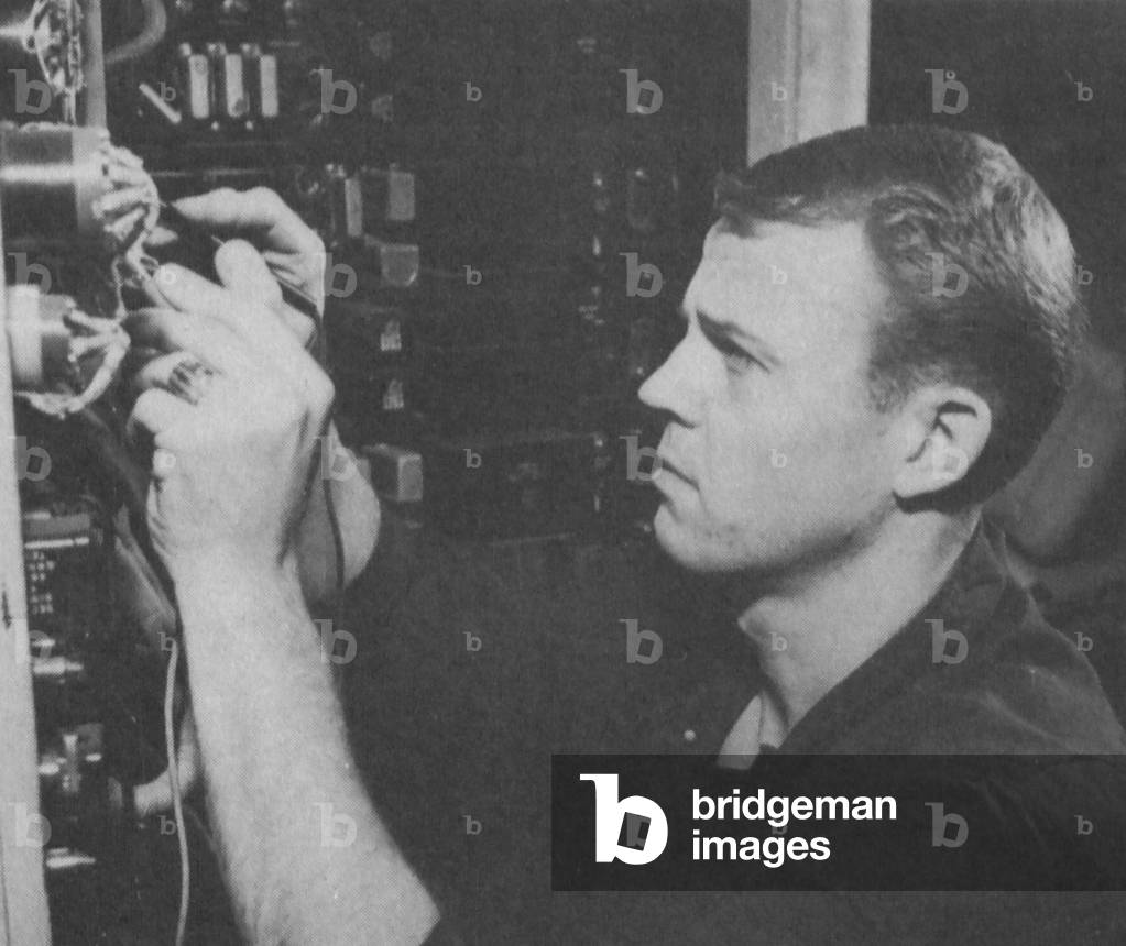 Man On Board The USS George Washington Submarine, Who Is Inspecting The Equipment In The Navigation Center