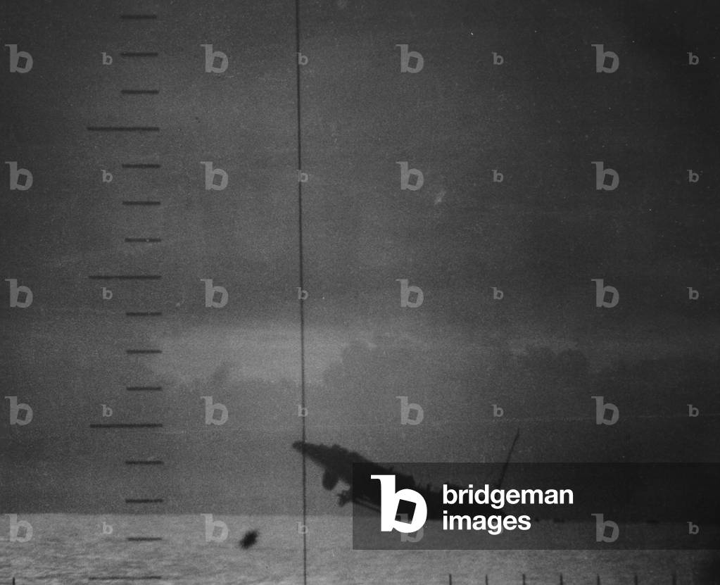 A Japanese Destroyer Sinking After Being Hit By Torpedoes From A US Submarine