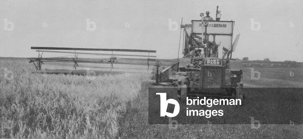 A Twenty- Foot Oliver Nichols & Shepard Combine And A 28-50 Hart-Parr Tractor