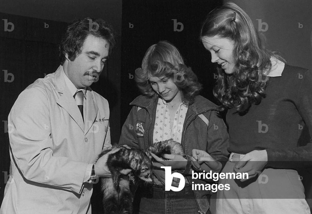 Doctor Kramer Shows Two Girls Some Ferrets