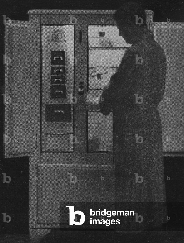 A Man Pouring A Glass Of Water From A Copeland Refrigerator Cabinet