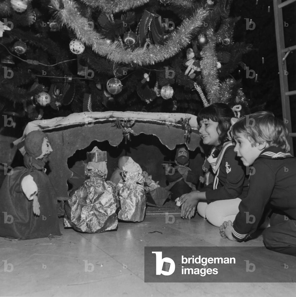 Children Sitting Under The Greek Tree At The Annual Christmas Around The World Festival