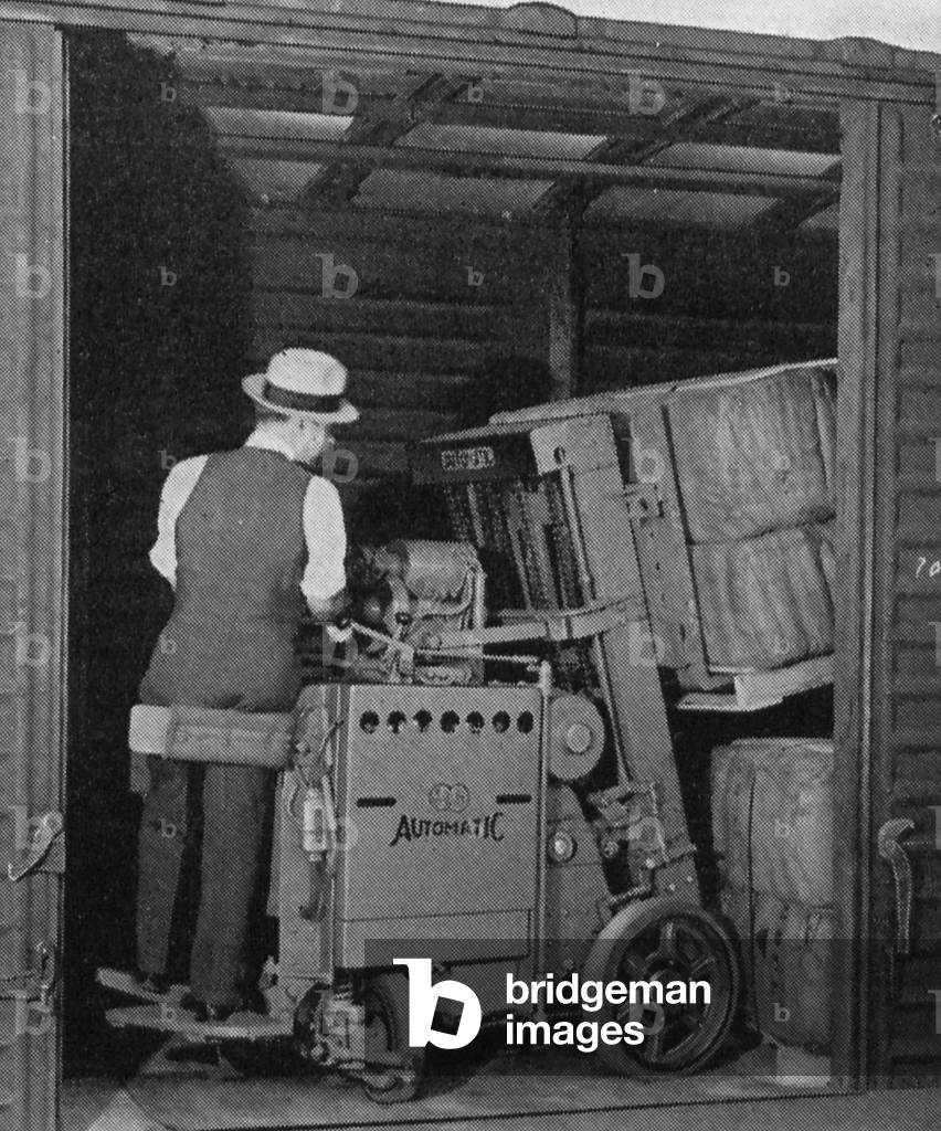 A Man Using An Automatic Transportation Company's TGTF Telescopic Type Truck