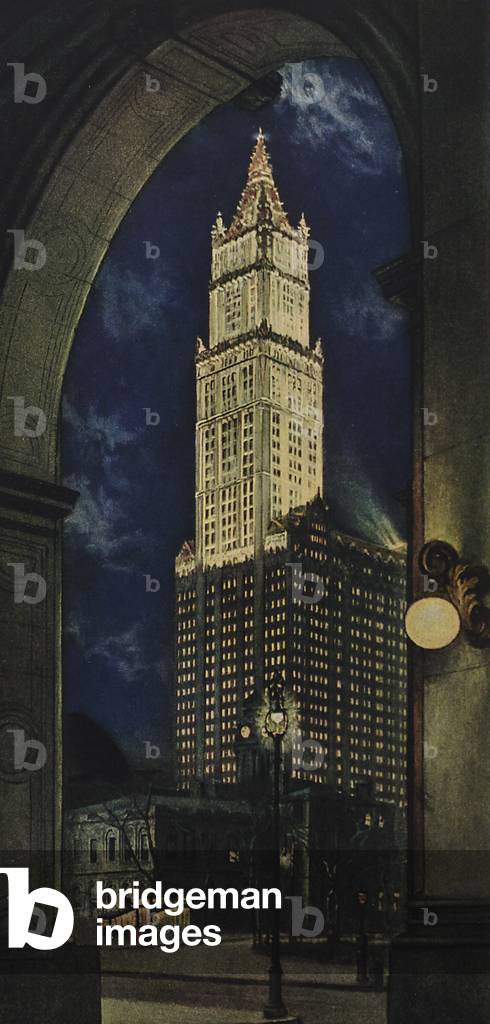 View Of The Woolworth Building, Also Known As The Cathedral Of Commerce, Through The Arch Of The Municipal Building, At Dusk