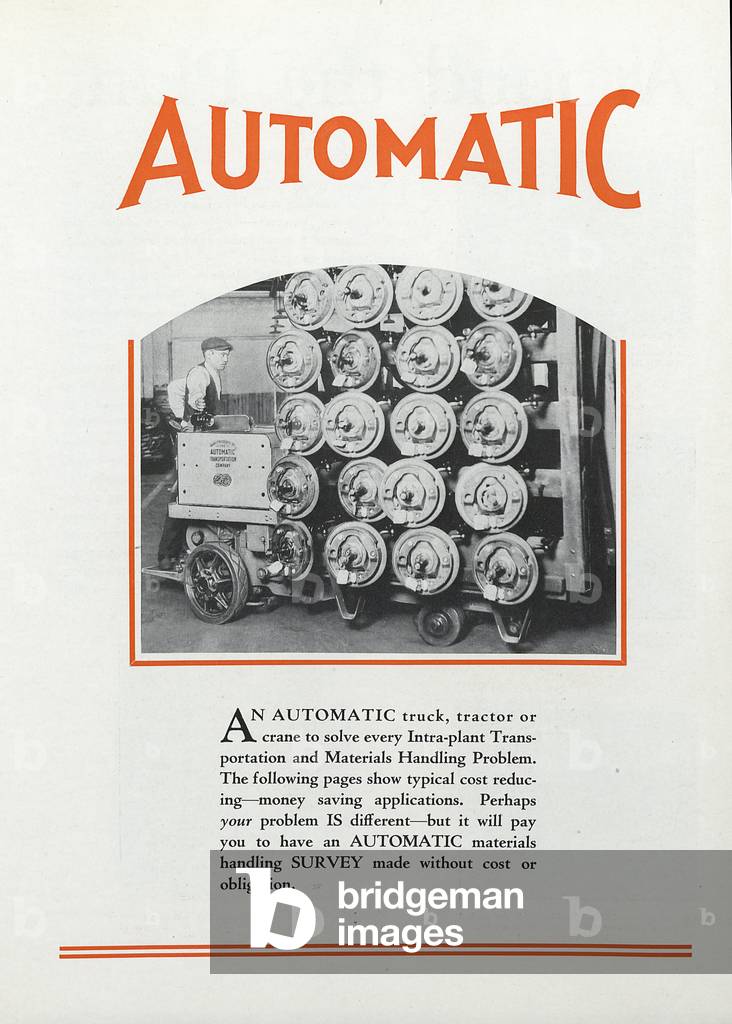 A Man Using An Automatic Transportation Company's Automatic Truck To Move Heavy Loads Within A Factory