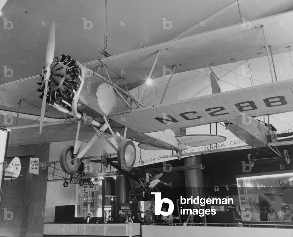 A Bi-Wing Plane Hanging From The Ceiling Inside The Museum Of Science And Industry